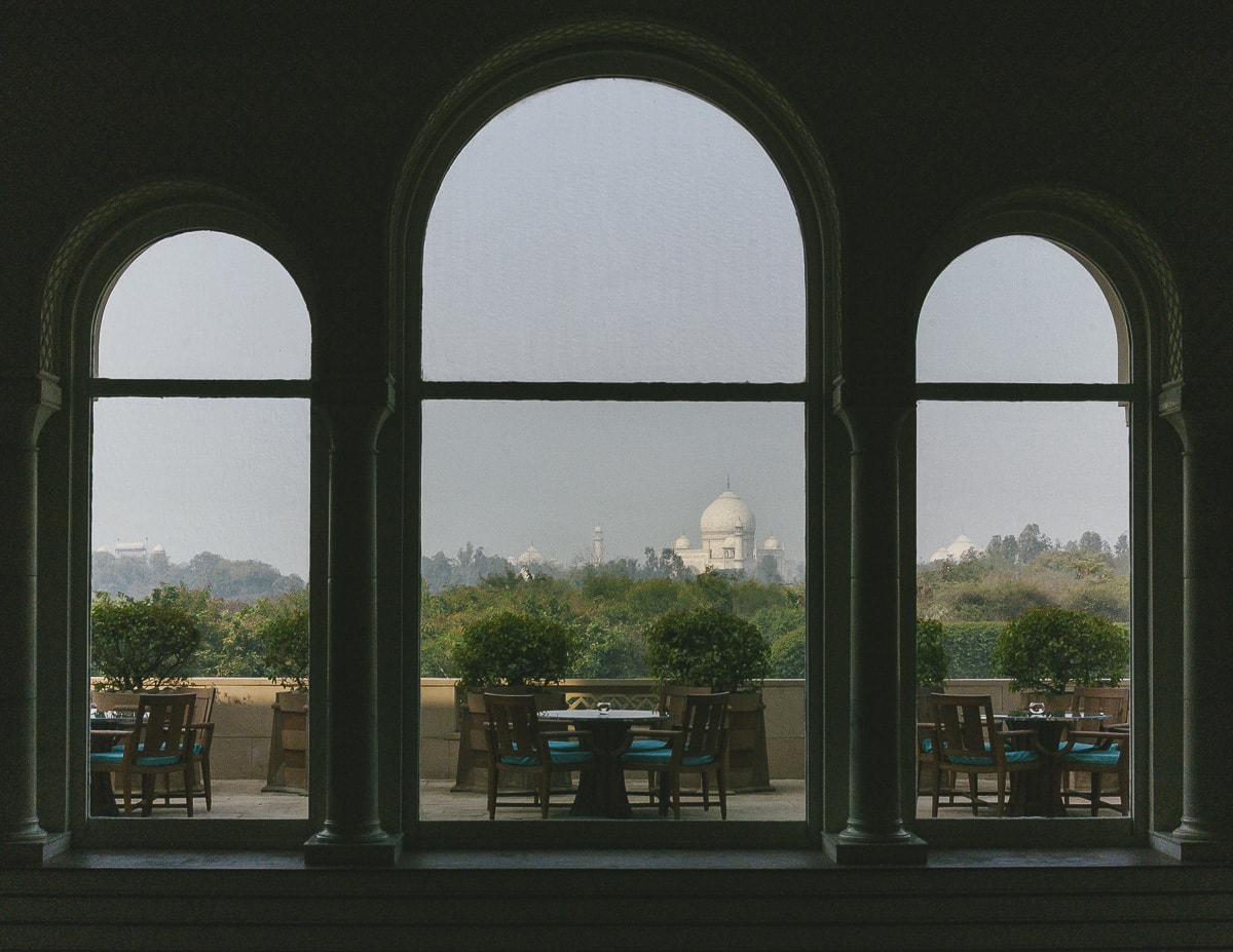 The Taj Mahal Through A Window In Agra