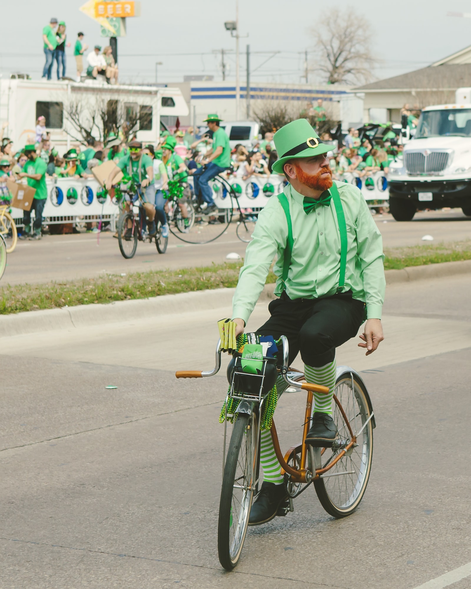 Aa leprechaun riding a bike in the parade