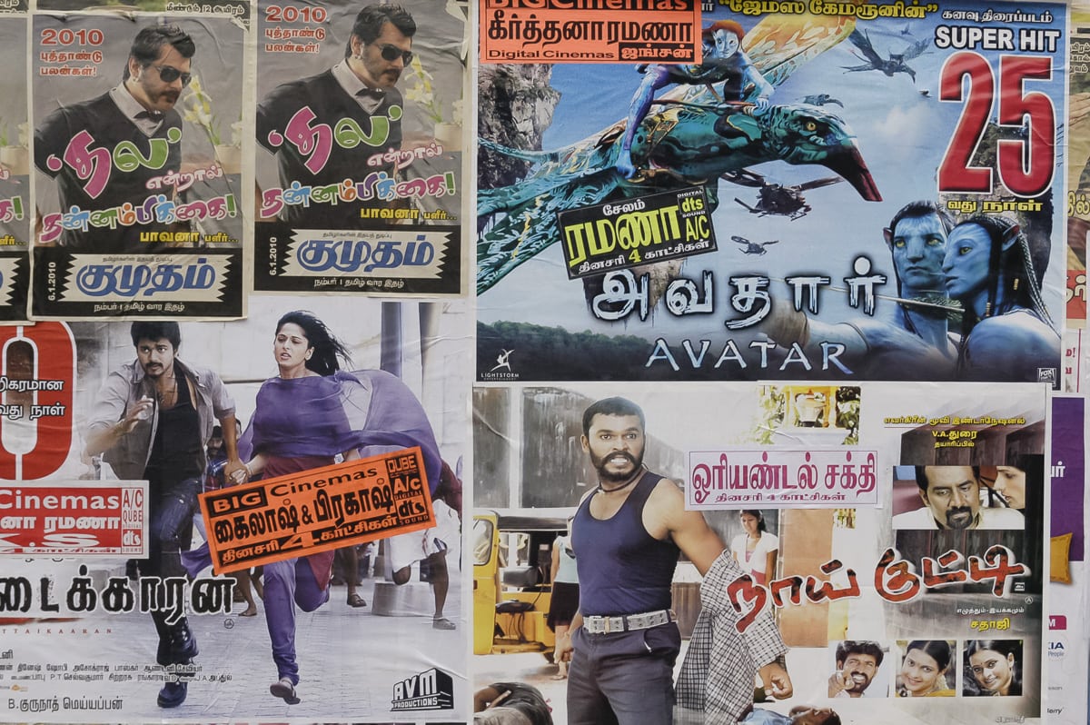 A wall of movie posters feating both Bollywood and Hollywood movies in Salem, India