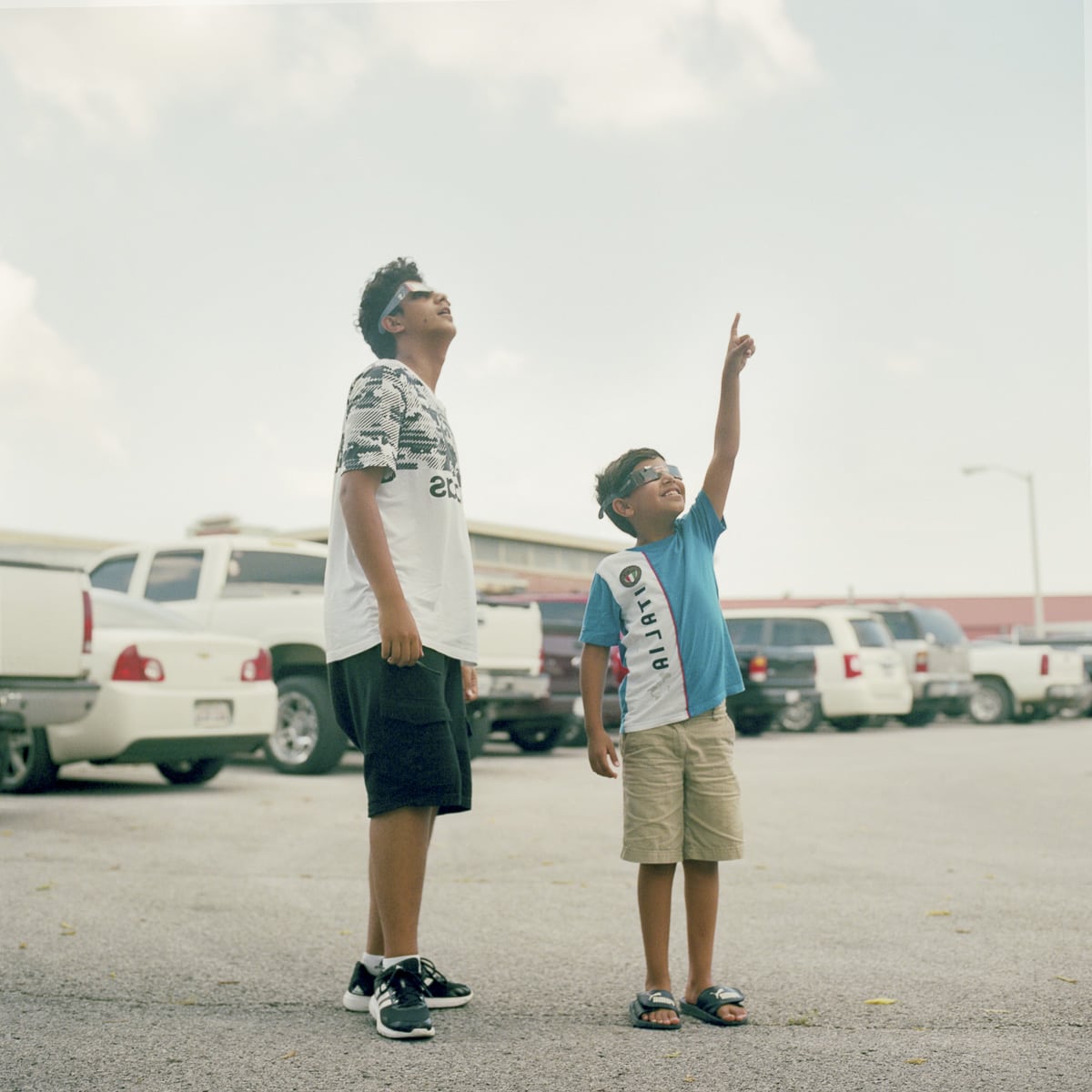 An analog portrait of two brothers watching the event in Carbondale, Illinois
