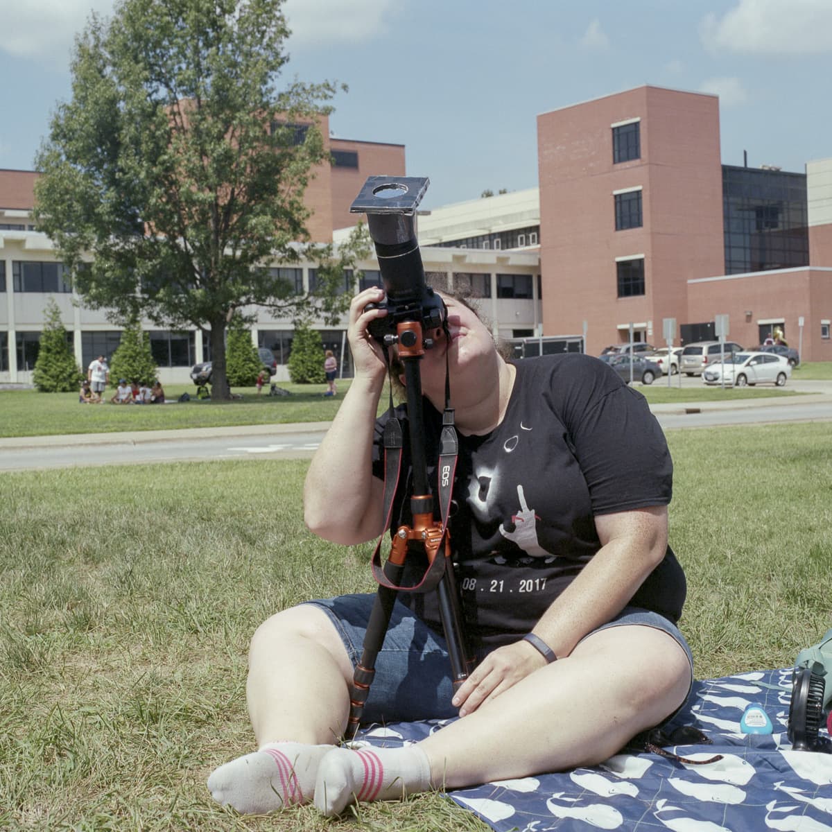 An analog portrait of a woman watching the event at SIU in Carbondale, Illinois