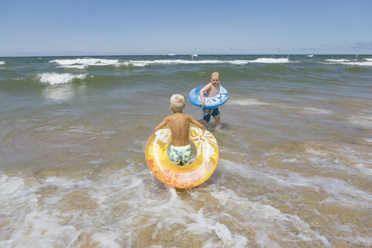 Boys playing in Lake Michigan at Holland Beach