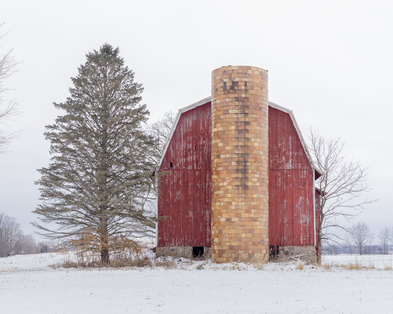 Old Red Dutch barn covered with snow, Martin, Michigan