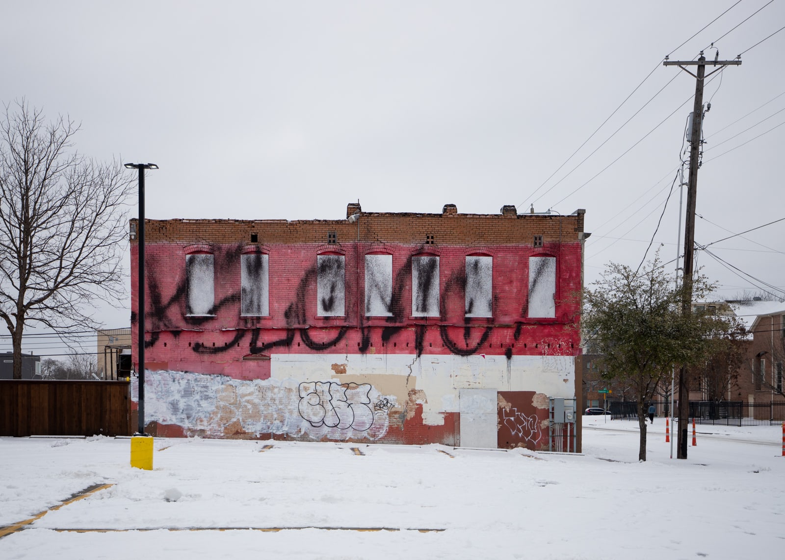 An old building with graffiti on it after the winter storm