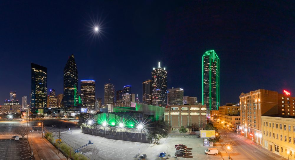 The Dallas skyline at night with the aquarium in view