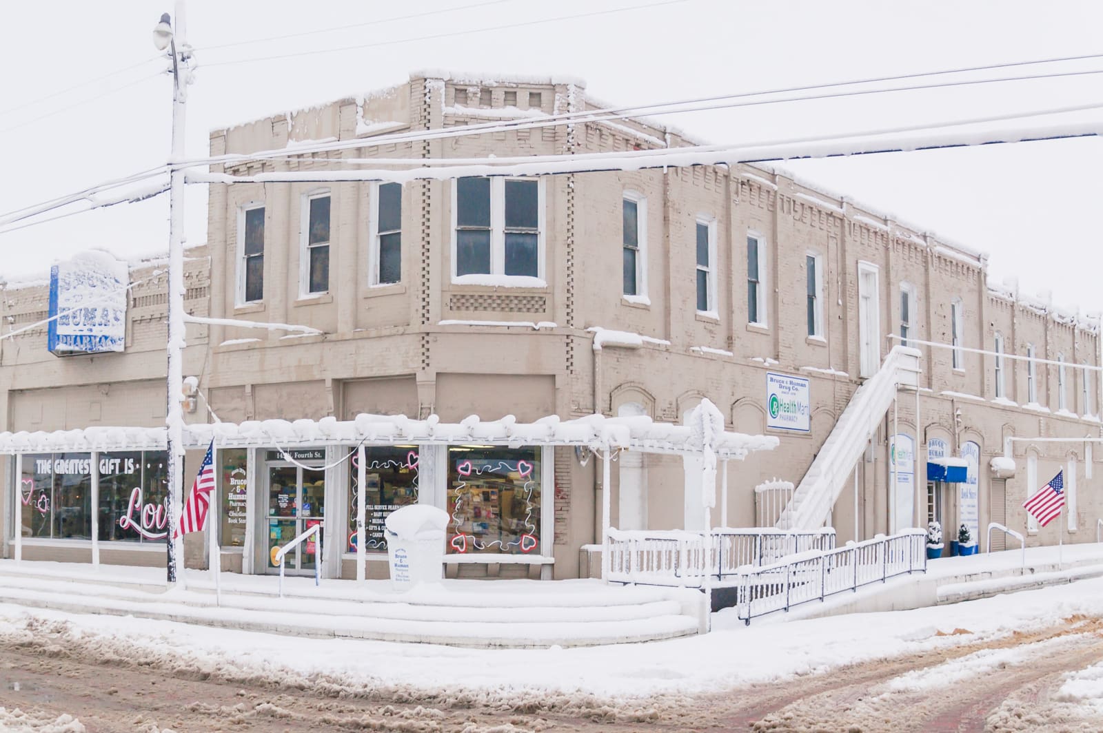 Bruce Human drug store covered with snow