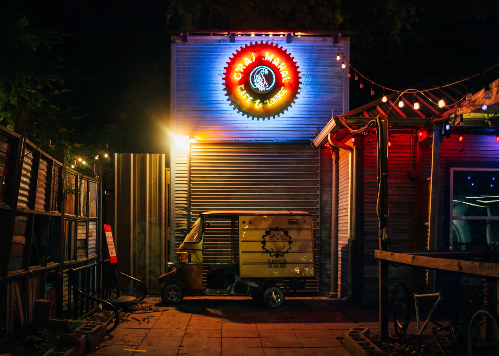 A rickshaw outside of a bar
