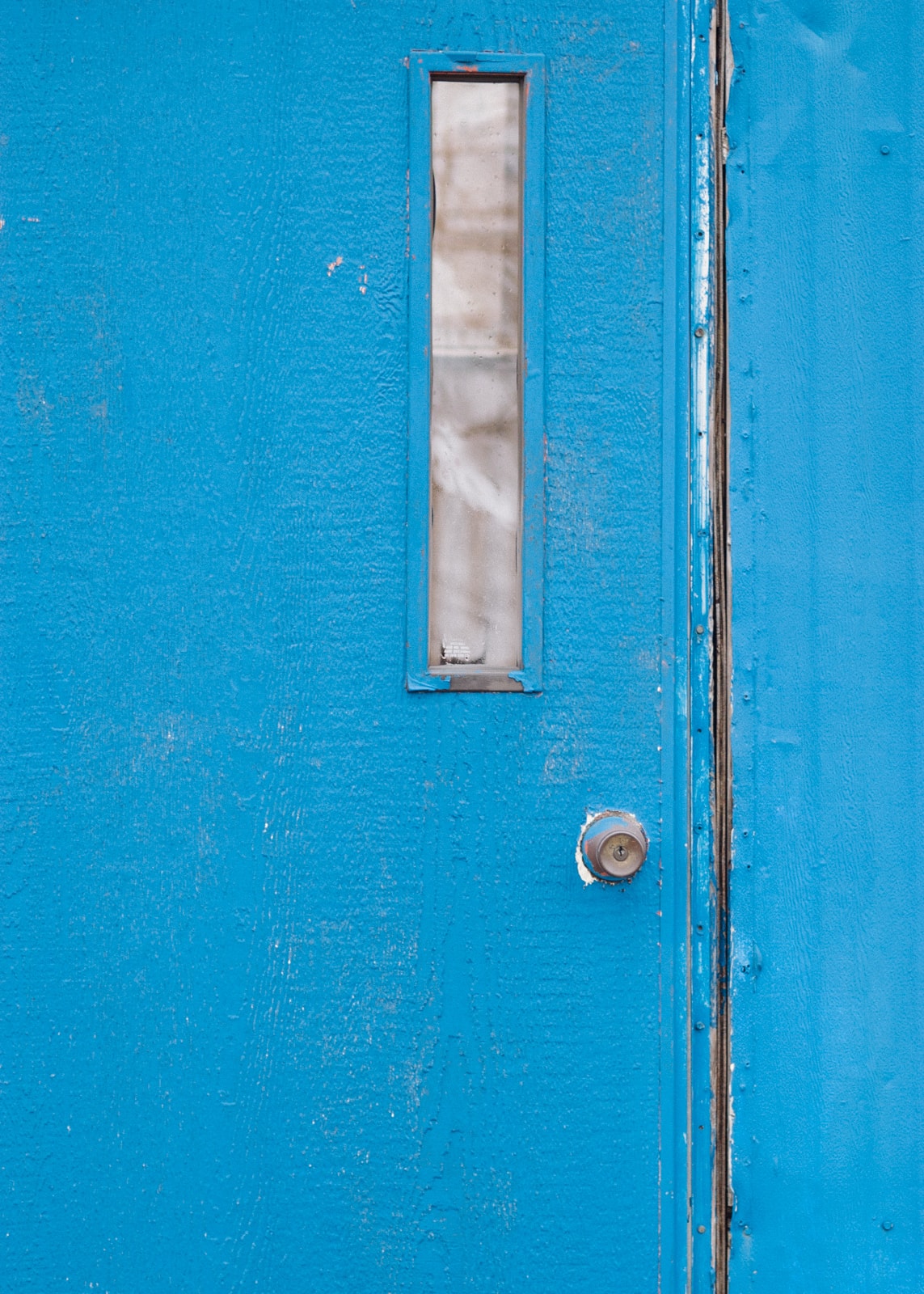 A blue mobile home door in Terrell, Texas