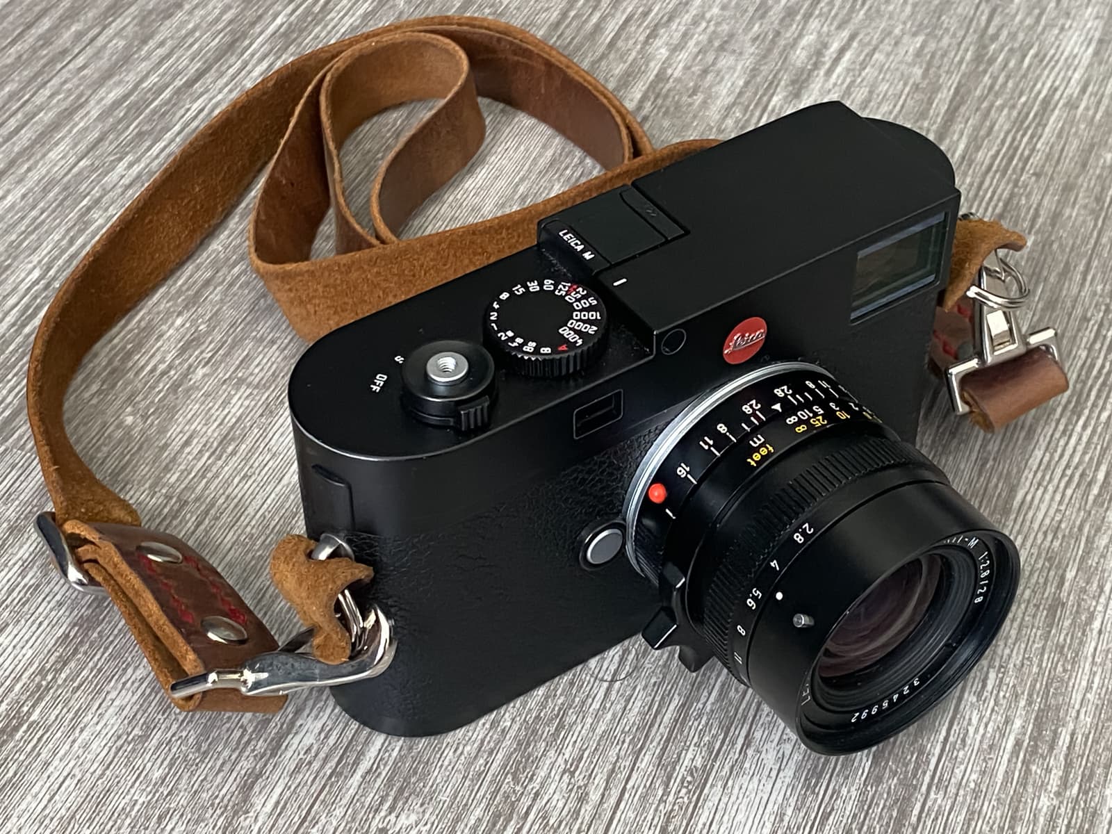 Leica M (Typ 262) front with a Leitz 28mm Elmarit lens and a leather strap by Trillo & Sons