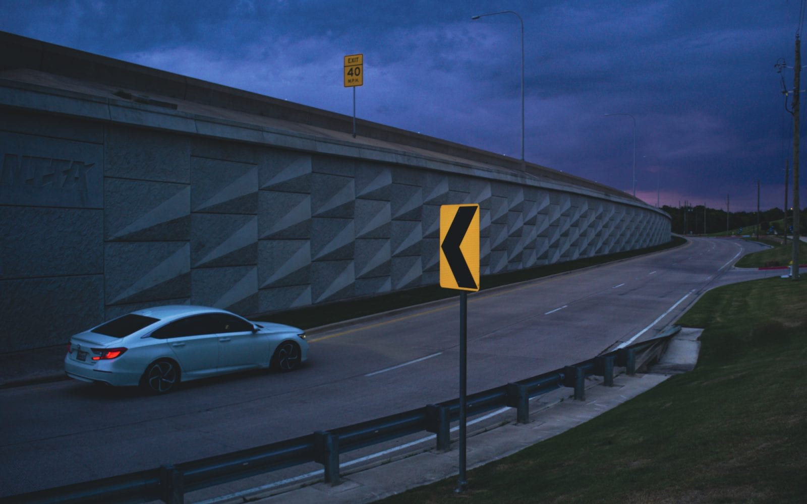 2021 Best Photos: Car driving along a service road at sunset