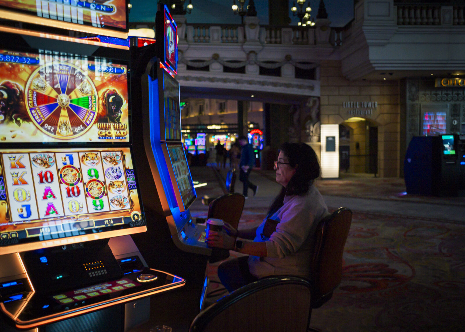 A woman gambling in a casino early the morning
