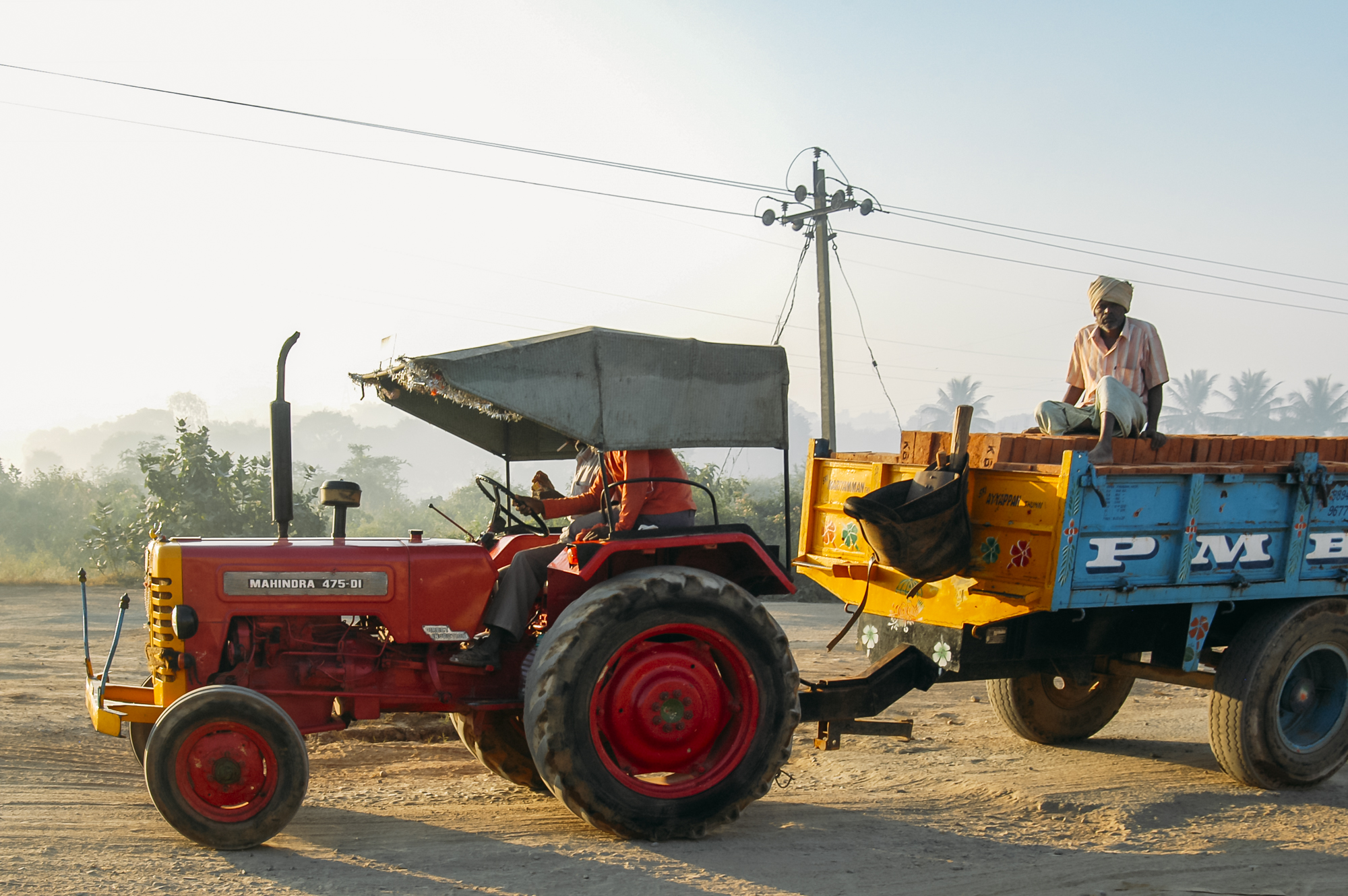 A farmer and tractor in Hosur, India