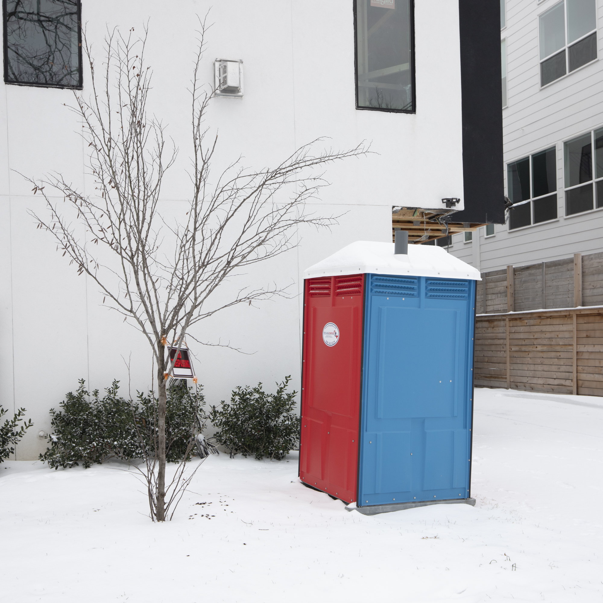 a colorful porta potty in the snow