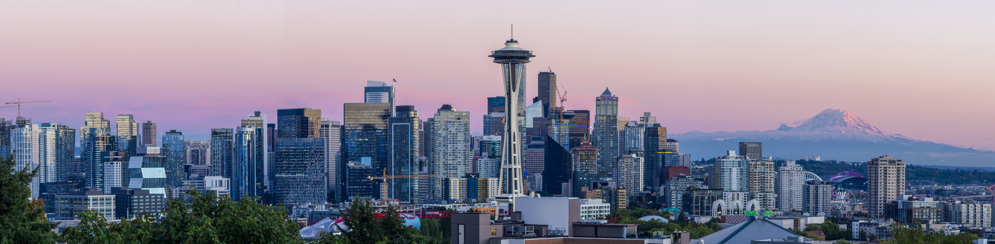 Seattle skyline at sunset with Mt. Rainier in the distance. 